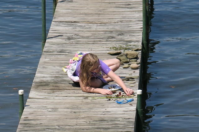 Julia assessing her treasures on the dock