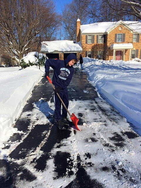 Nathan helps with the final driveway cleaning