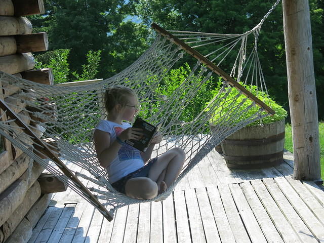 Julia reading in the hammock