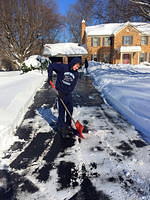 Nathan helps with the final driveway cleaning