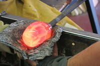 The flower then got dipped in hot glass to get another blob around it. 